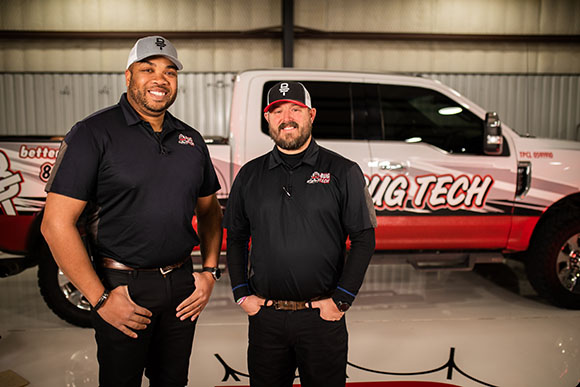 Technicians in front of truck